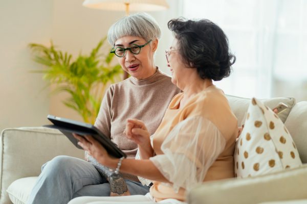Mother and daughter looking at online documents