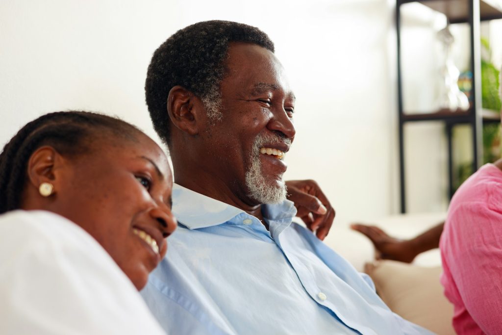 Daughter resting head on Fathers shoulder