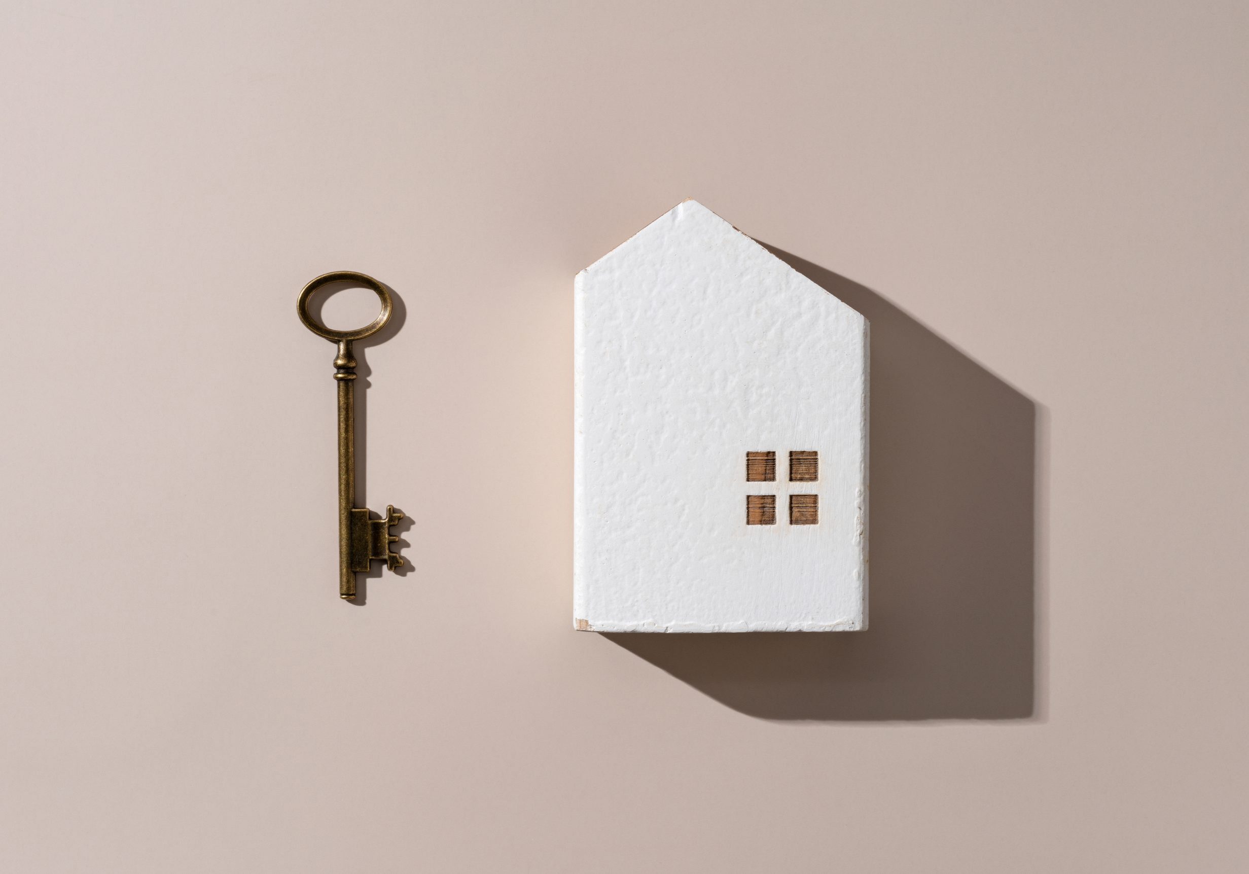 Model,Of,A,House,With,Brass,Keys,Placed,On,A